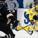 Michigan sophomore center Travis Lynch shoots on an empty net in the third period of the game against Western Michigan on Saturday. Daniel Brenner I AnnArbor.com